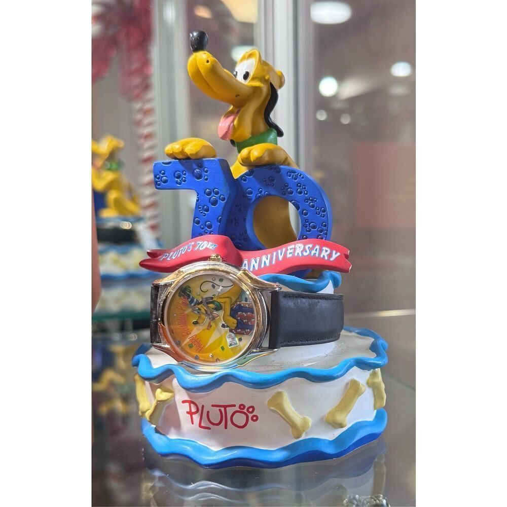 Pluto's 70th Birthday watch and sculpture.